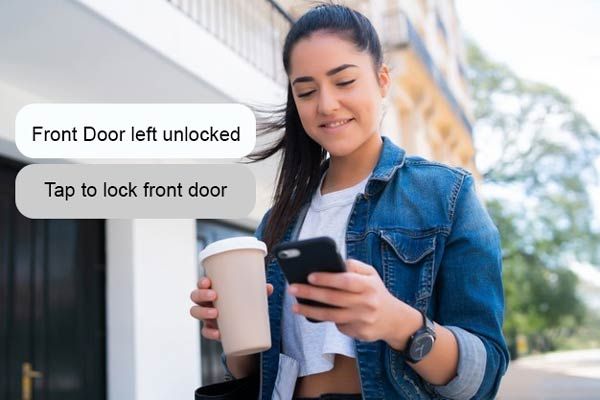 Woman Checking Home Alarm System